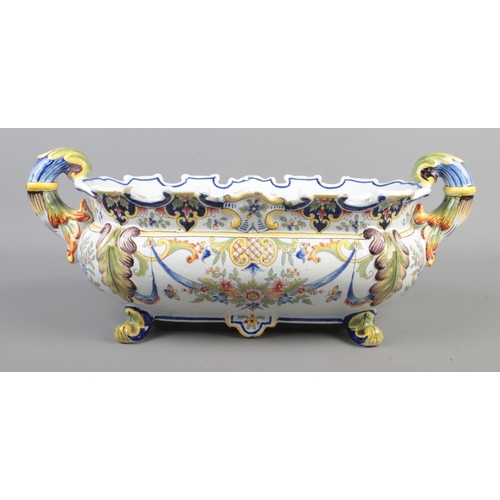 173 - A 19th century Italian faience centrepiece bowl with acanthus decorated handles and feet