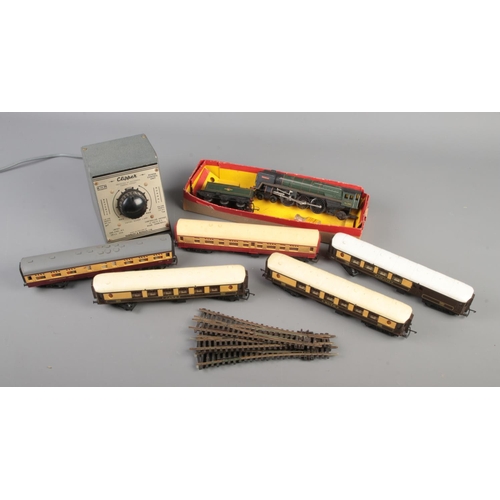 175 - A collection of mostly Tri Ang OO gauge model railway. Includes R259 locomotive and tender, passenge... 