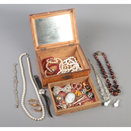 178 - A vintage wooden jewellery box with contents of costume jewellery. Includes Limoges cameo brooch, en... 