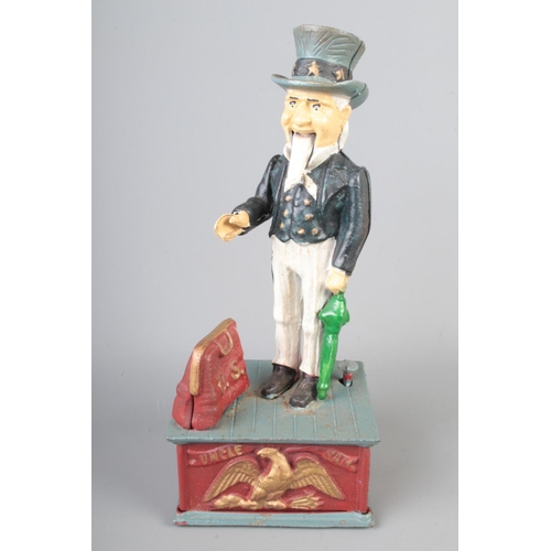 18 - A reproduction American cast iron 'Uncle Sam' money box. Height: 28cm.