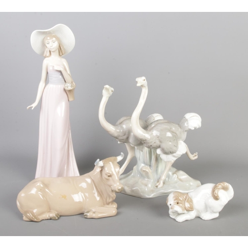 199 - Four Nao by Lladro ceramic figures to include Ostrich figure group, girl with flower basket, dog and... 