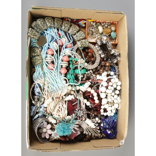 204 - A tray of costume jewellery including beaded necklaces, bangles and bracelets, earrings etc