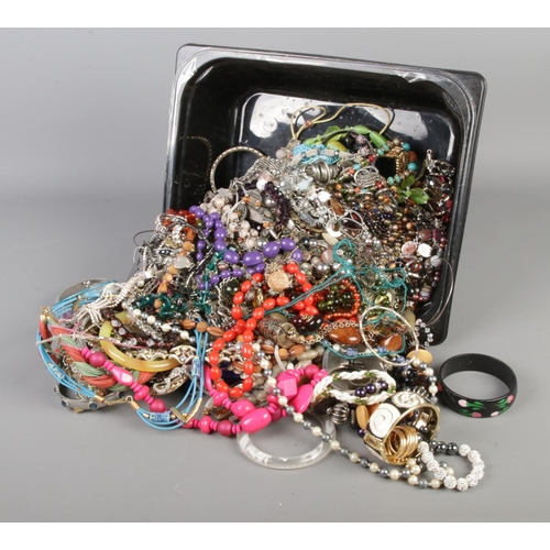 206 - A large tray of costume jewellery including bangles, beaded necklaces, rings etc