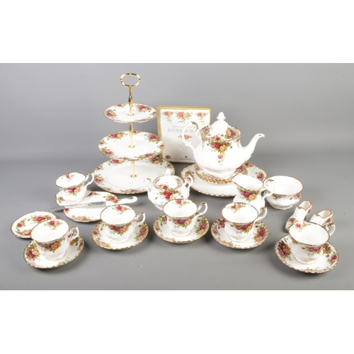 228 - A quantity of Royal Albert Old Country Roses. To include teapot, cups and saucers, cake stand with b... 