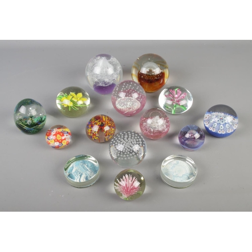 230 - A collection of glass paperweights, to include bubble set, millefiori and Caithness Moon Crystal exa... 