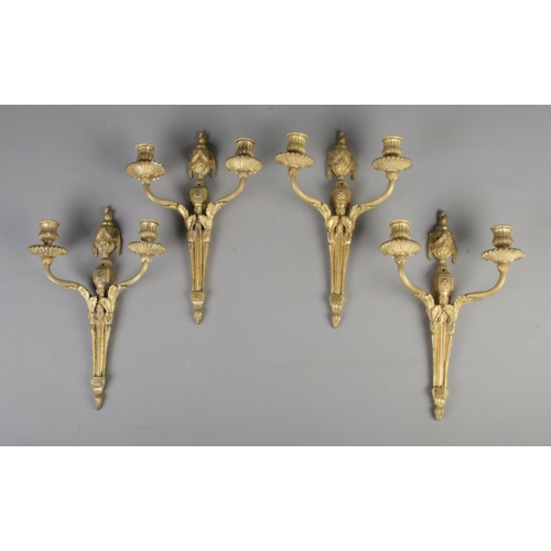 232 - Four matching vintage brass wall mounted sconces/candle holders, with intricate design and decoratio... 