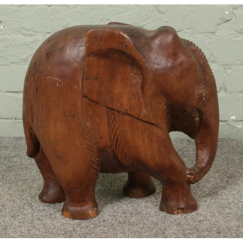 246 - A large carved wooden elephant ornament, height 37 x width 38cm