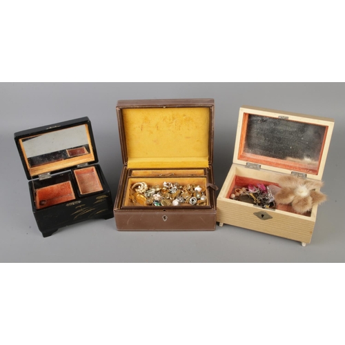 248 - Three vintage jewellery boxes containing a small quantity of costume jewellery to include brooches, ... 