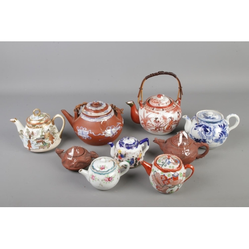 250 - Nine mixed vintage Chinese & Japanese clay and ceramic teapots, some of them have bottom marks