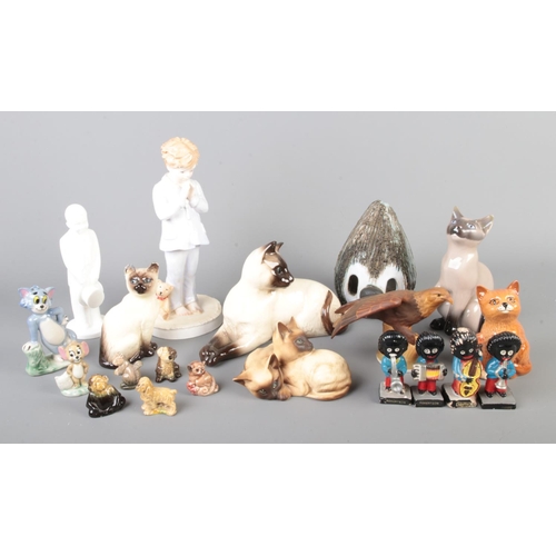 26 - A collection of assorted ceramic figures to include Bing & Grondahl Siamese cat, Royal Doulton NSPCC... 