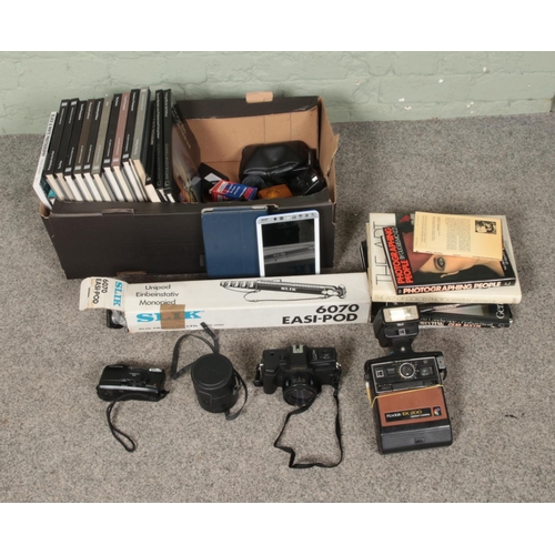 260 - A box of assorted cameras, accessories and reference guides to include Kodak EK200, Nippon AR-4392, ... 