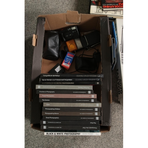 260 - A box of assorted cameras, accessories and reference guides to include Kodak EK200, Nippon AR-4392, ... 