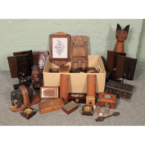 268 - A large collection of treen and wooden items including trinket boxes, music boxes, carved figure of ... 