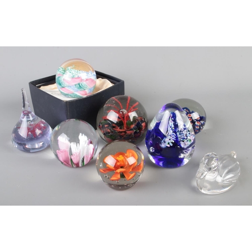 27 - A collection of assorted art glass paperweights to include boxed Caithness Cauldron designed by Inne... 