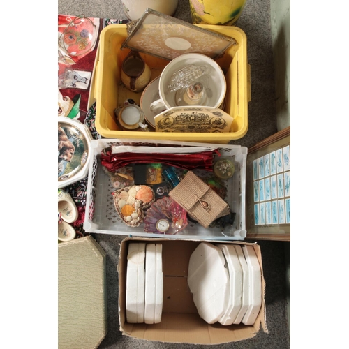 299 - Three boxes of miscellaneous to include seashell collectables, assorted glassware, decorative comedy... 