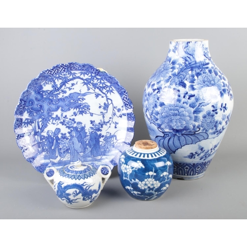 35 - A collection of oriental blue and white ceramics including ginger jar with cork top, lidded pot, lar... 