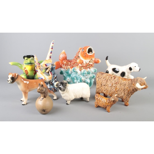 37 - A collection of ceramic animals including large koi fish, novelty frog teapot, dog, ram, boxer dog, ... 