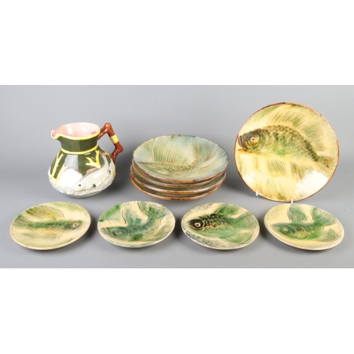 39 - A collection of Spanish Vila Clara fish plates and bowls together with a Shorter jug