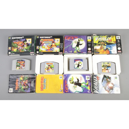 406 - A boxed Nintendo 64 console, together with four game cartridges. Contains Diddy Kong Racing, Gex64, ... 