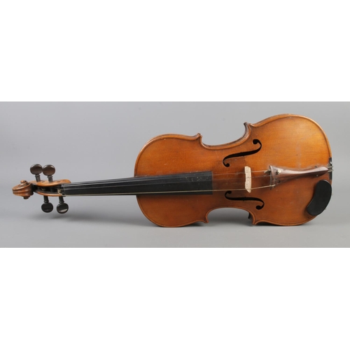 407 - A cased violin with two bows. Having 14 inch two piece back.