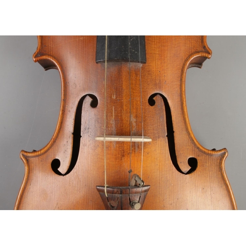 407 - A cased violin with two bows. Having 14 inch two piece back.