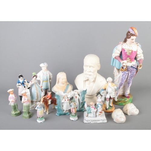 44 - A collection of antique and later ceramics including various figurines and two busts depicting Queen... 