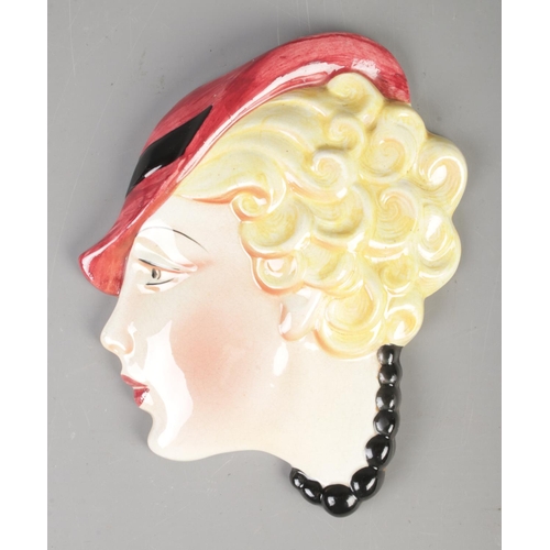 50 - An Art Deco 1920's porcelain wall mask, stamped to the reverse C & Co, for Cope and Co, No. 13.