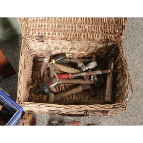 430 - A box and a basket of vintage hand tools along with five spirit levels. Includes plane, measures, br... 