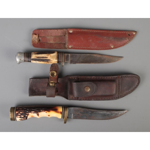 67 - Two hunting knifes to include Uncle Henry Schrade 153UH Golden Spike with simulated horn handle and ... 