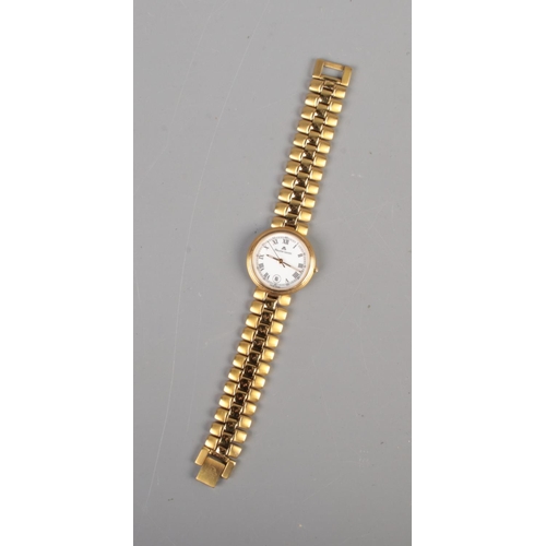 517 - A Maurice Lacroix ladies quartz wristwatch, number 79542 featuring roman numeral dial and date displ... 