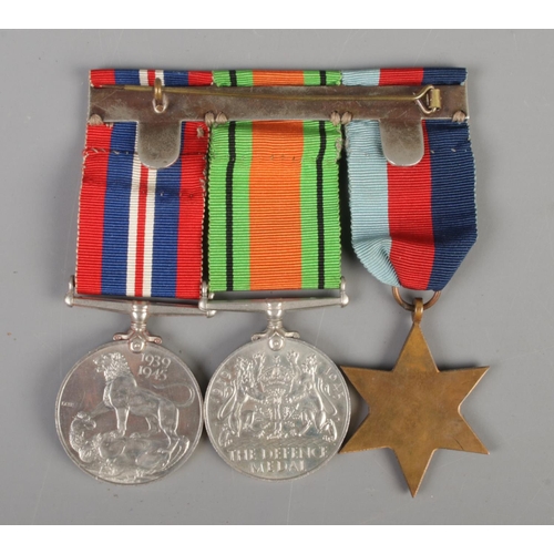 519 - A group of three British World War Two campaign medals. Includes War Medal, The Defence Medal and 19... 