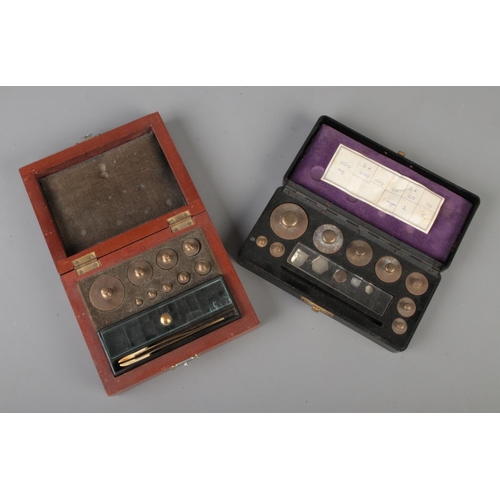 72 - Two cased sets of chemical weights.