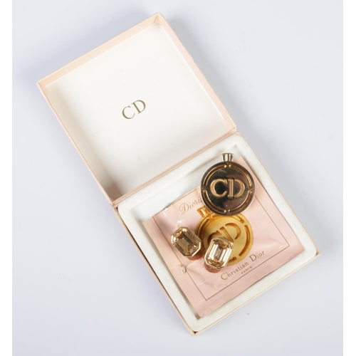 549 - A small collection of Christian Dior to include pair of yellow metal clip earrings and a boxed recha... 