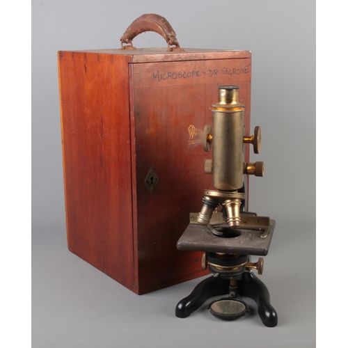 73 - A Watson & Son 'Service' microscope in wooden case.