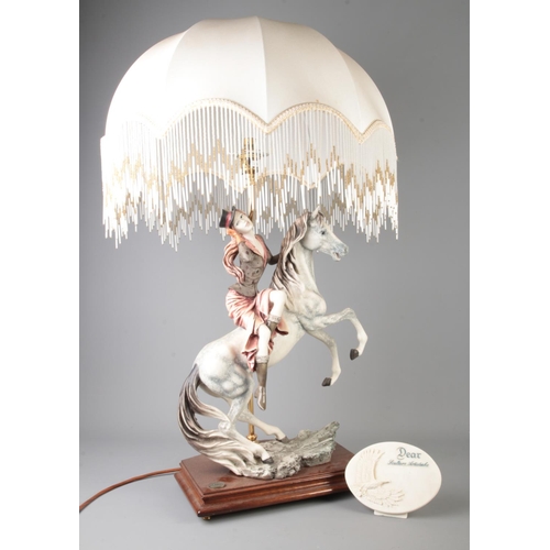 76 - Auro Belgari for Dear, Italy, a figural lamp modelled as a lady on a horse.