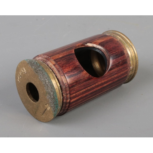 574 - A vintage Von Cort corner polemoscope featuring brass mounts. Approx. length 6cm.