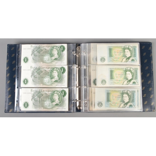 593 - A folder containing a large collection of mainly Bank of England bank notes, including uncirculated ... 