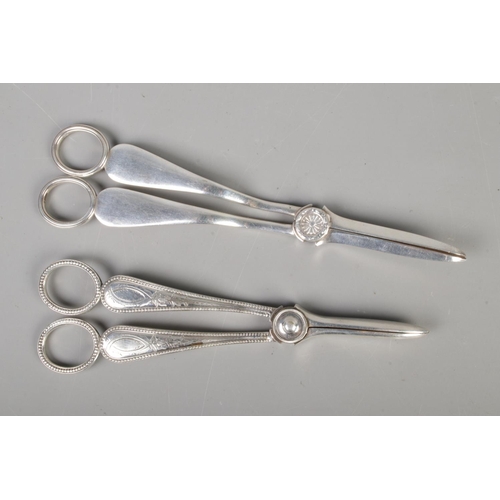 604 - Two pairs of silver plate grape scissors.