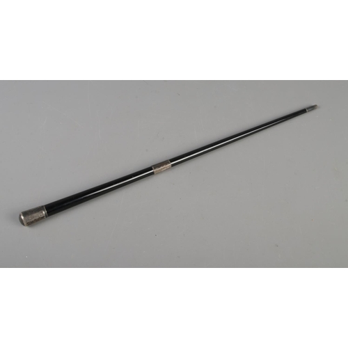 606 - A silver mounted and ebonised conductor's baton. The mounts assayed for Birmingham and London, 1934 ... 