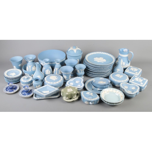 84 - A large collection of mainly Wedgwood jasperware. Includes Embossed Queen's Ware, Christmas plates, ... 