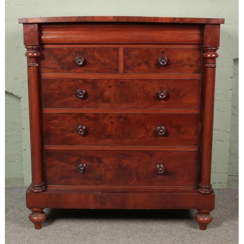 624 - A Victorian mahogany Scottish chest of drawers. Raised on plinth with turned supports.