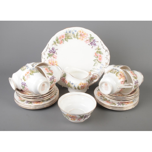 86 - A Paragon part tea service in the Country Lane pattern to include milk jug, sugar bowl, tea cups and... 