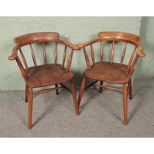 629 - A pair of ash/elm smokers bow arm chairs.