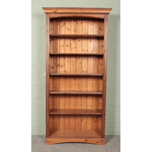 636 - A large pine open bookcase.