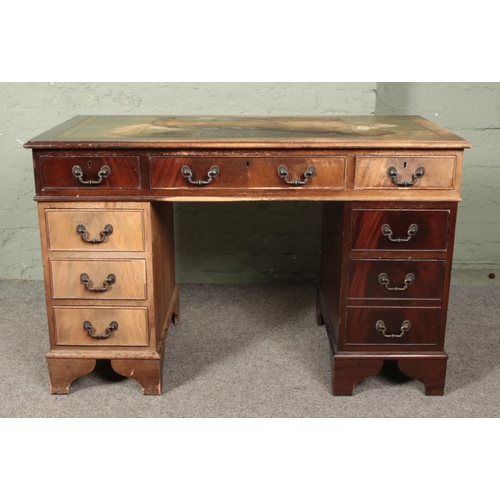 637 - A mahogany twin pedestal desk.