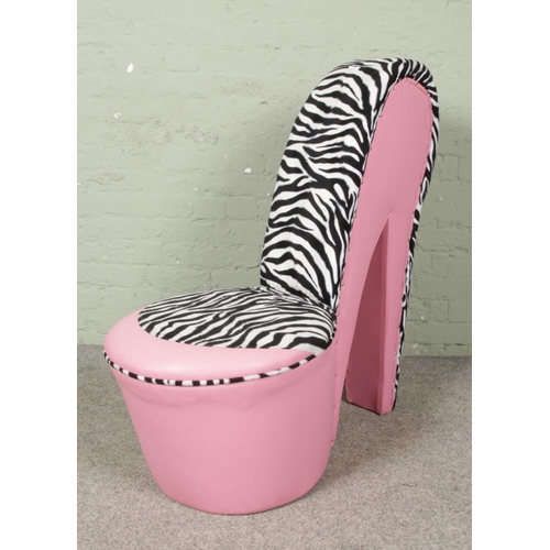 652 - A pink high heel shoe chair, novelty design  in the form of a stiletto shoe, with faux pink leather ... 