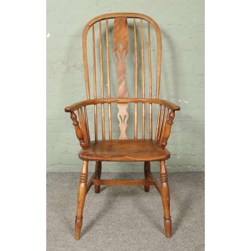 663 - An ash/elm Windsor arm chair.