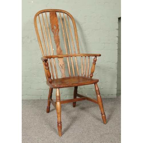 663 - An ash/elm Windsor arm chair.