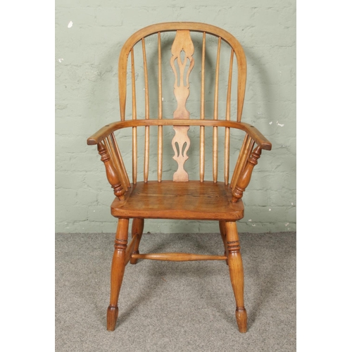 664 - An ash/elm Windsor arm chair.