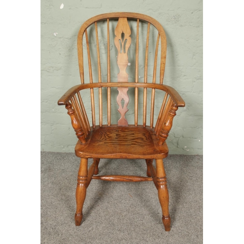 665 - An ash/elm Windsor arm chair.